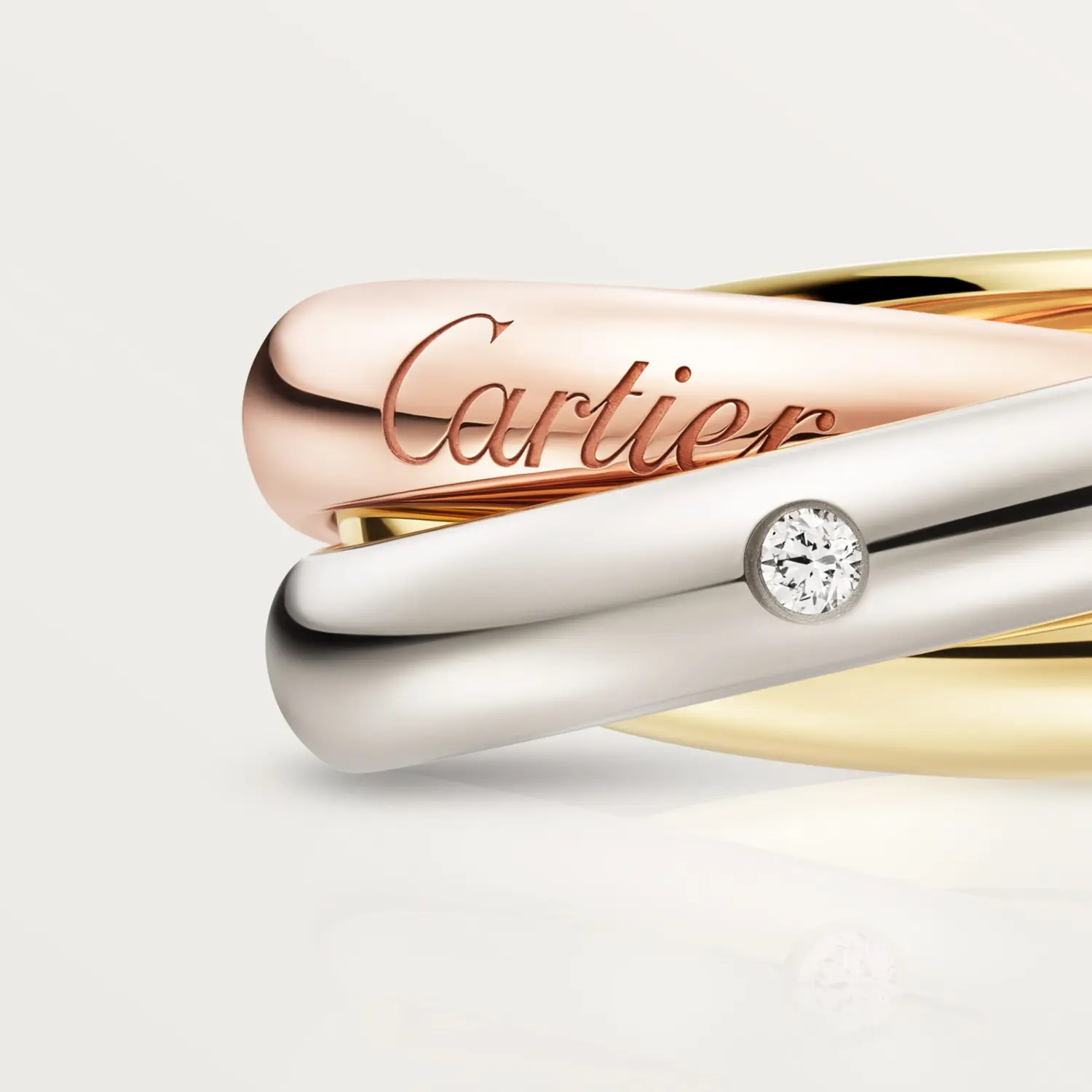 картинка Кольцо Cartier Trinity с бриллиантами из трех видов золота от магазина Одежда+