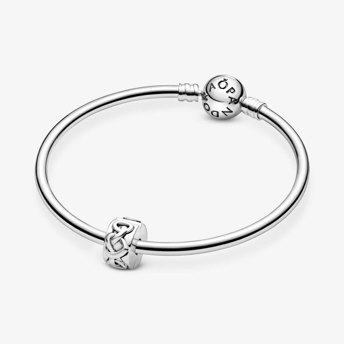 картинка Шарм-клипса Pandora Moments Knotted Hearts, серебро от магазина Одежда+