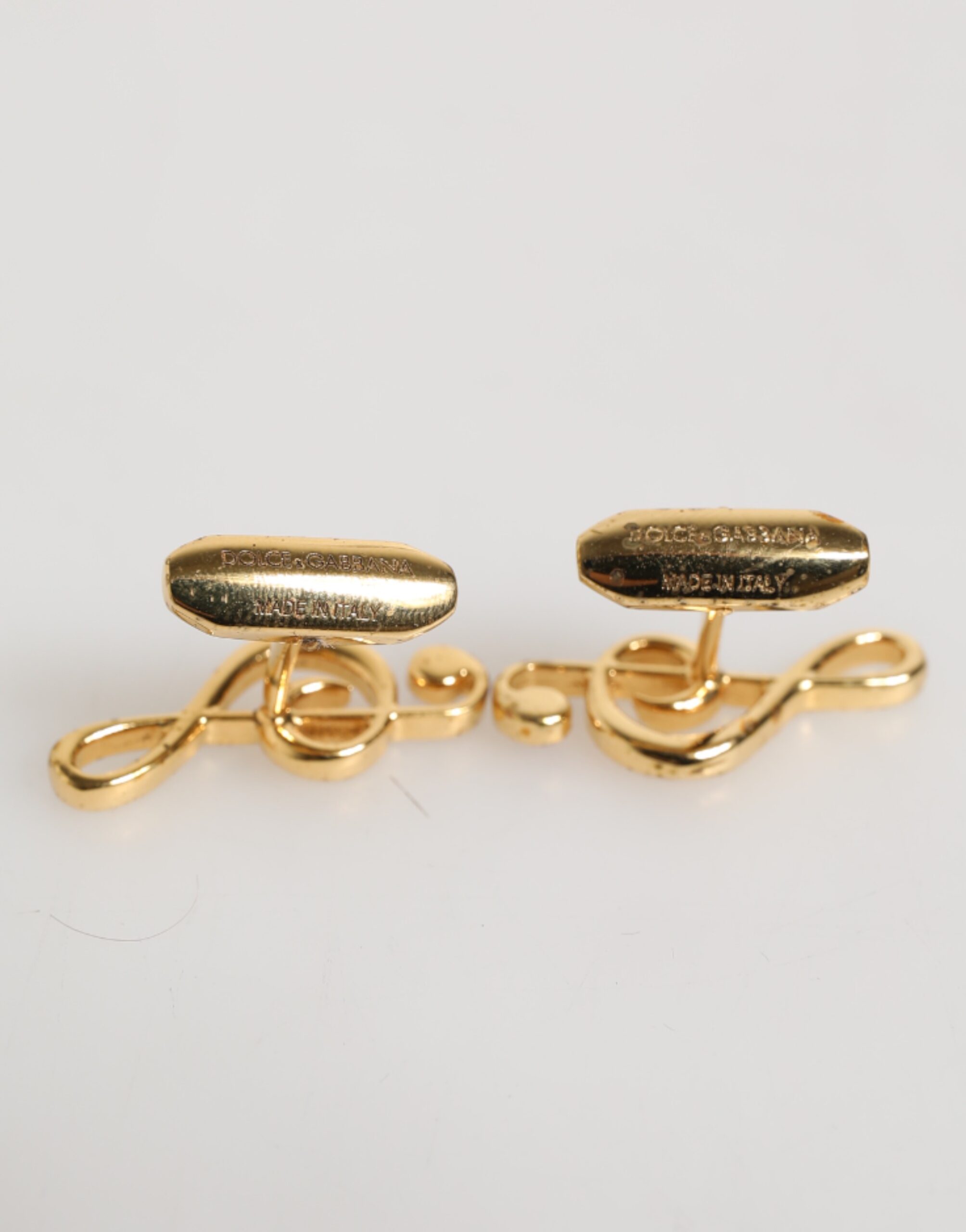 картинка Запонки мужские металлические, золотые, с музыкальной нотой Dolce & Gabbana, золото от магазина Одежда+