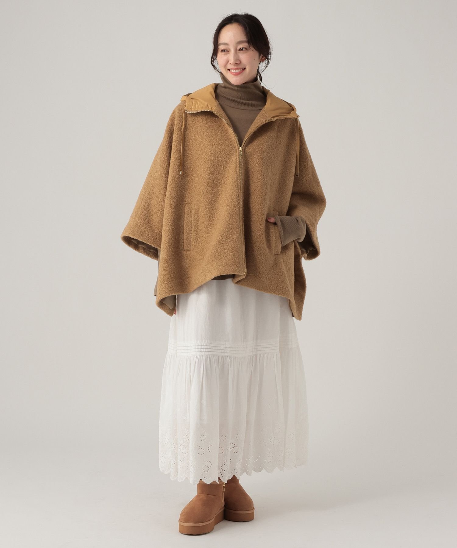 картинка Кудрявое лохматое пончо/632315 Elura, Camel 53 от магазина Одежда+